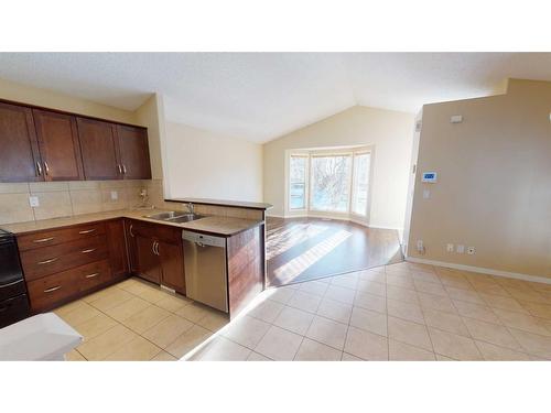 207 Cranberry Close Se, Calgary, AB - Indoor Photo Showing Kitchen With Double Sink