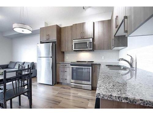 110-20 Sage Hill Terrace Nw, Calgary, AB - Indoor Photo Showing Kitchen With Stainless Steel Kitchen With Double Sink