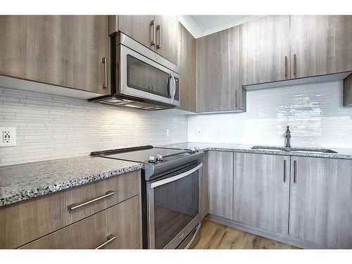 110-20 Sage Hill Terrace Nw, Calgary, AB - Indoor Photo Showing Kitchen With Stainless Steel Kitchen With Upgraded Kitchen