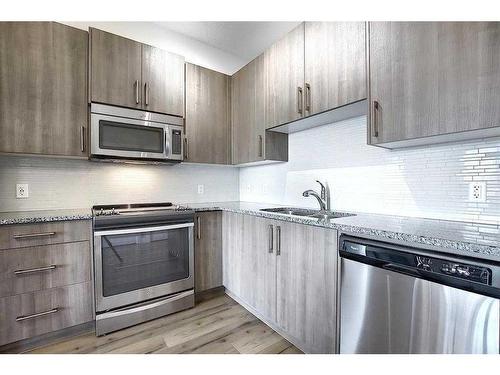 110-20 Sage Hill Terrace Nw, Calgary, AB - Indoor Photo Showing Kitchen With Stainless Steel Kitchen With Double Sink With Upgraded Kitchen