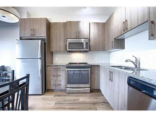 110-20 Sage Hill Terrace Nw, Calgary, AB - Indoor Photo Showing Kitchen With Stainless Steel Kitchen With Double Sink