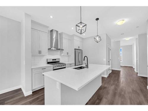 371 Hotchkiss Manor Se, Calgary, AB - Indoor Photo Showing Kitchen With Double Sink With Upgraded Kitchen