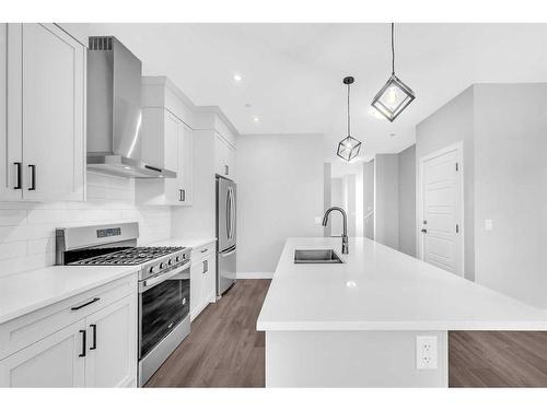 371 Hotchkiss Manor Se, Calgary, AB - Indoor Photo Showing Kitchen With Double Sink With Upgraded Kitchen