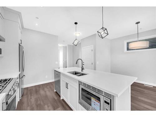 371 Hotchkiss Manor Se, Calgary, AB - Indoor Photo Showing Kitchen With Double Sink With Upgraded Kitchen