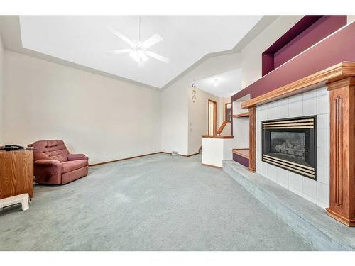 126 Somerset Drive Sw, Calgary, AB - Indoor With Fireplace