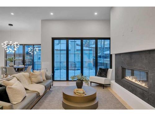 2326 3 Avenue Nw, Calgary, AB - Indoor Photo Showing Living Room With Fireplace