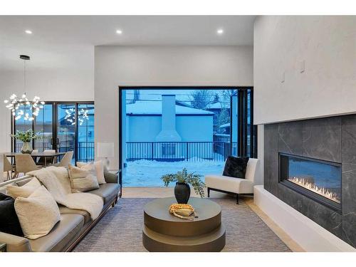 2326 3 Avenue Nw, Calgary, AB - Indoor Photo Showing Living Room With Fireplace