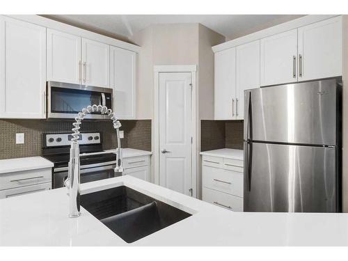 99 Evansborough Crescent Nw, Calgary, AB - Indoor Photo Showing Kitchen With Double Sink