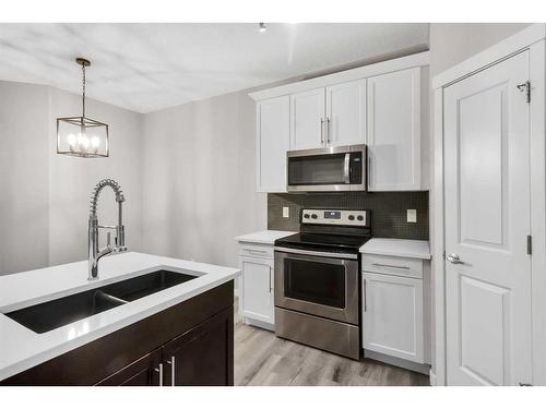 99 Evansborough Crescent Nw, Calgary, AB - Indoor Photo Showing Kitchen With Double Sink