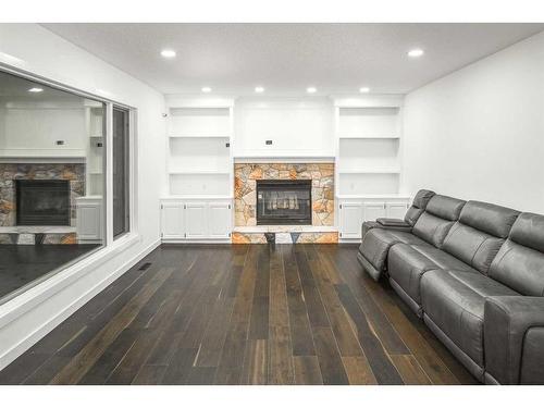 919 Shawnee Drive Sw, Calgary, AB - Indoor Photo Showing Living Room With Fireplace