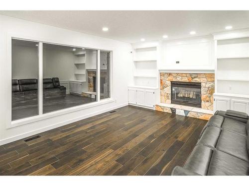 919 Shawnee Drive Sw, Calgary, AB - Indoor Photo Showing Living Room With Fireplace