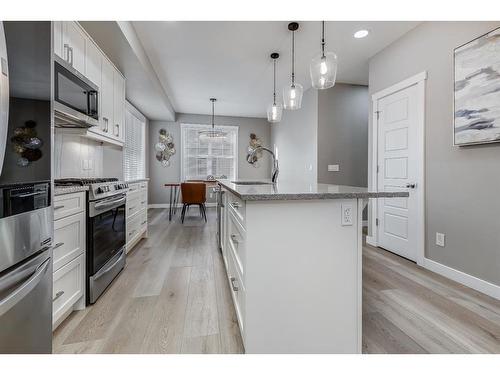 125 Cranbrook Villas Se, Calgary, AB - Indoor Photo Showing Kitchen With Upgraded Kitchen