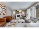 125 Cranbrook Villas Se, Calgary, AB  - Indoor Photo Showing Living Room With Fireplace 