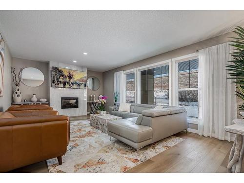 125 Cranbrook Villas Se, Calgary, AB - Indoor Photo Showing Living Room With Fireplace