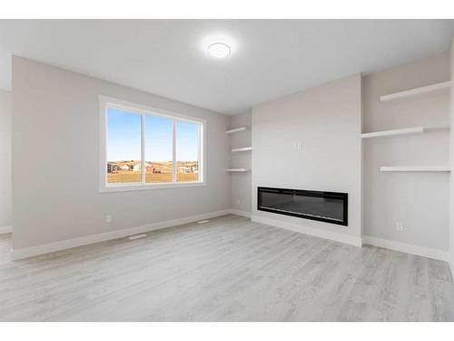 494 Clydesdale Way, Cochrane, AB - Indoor Photo Showing Other Room With Fireplace