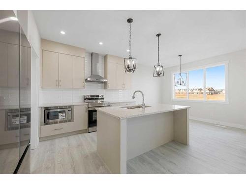 494 Clydesdale Way, Cochrane, AB - Indoor Photo Showing Kitchen With Upgraded Kitchen