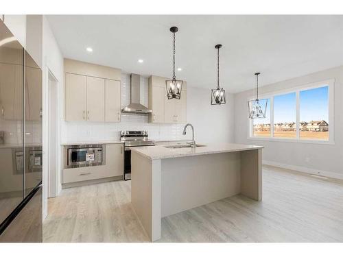 494 Clydesdale Way, Cochrane, AB - Indoor Photo Showing Kitchen With Upgraded Kitchen