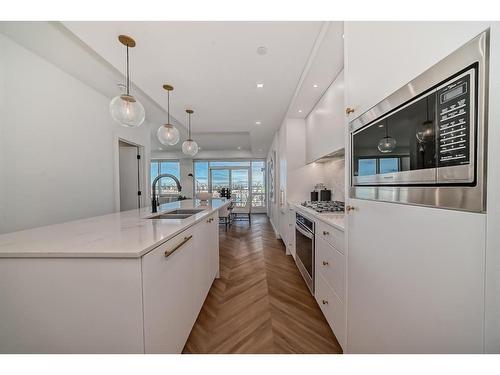 317-8505 Broadcast Avenue Sw, Calgary, AB - Indoor Photo Showing Kitchen With Double Sink With Upgraded Kitchen