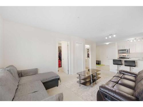 3408-4641 128 Avenue Ne, Calgary, AB - Indoor Photo Showing Living Room