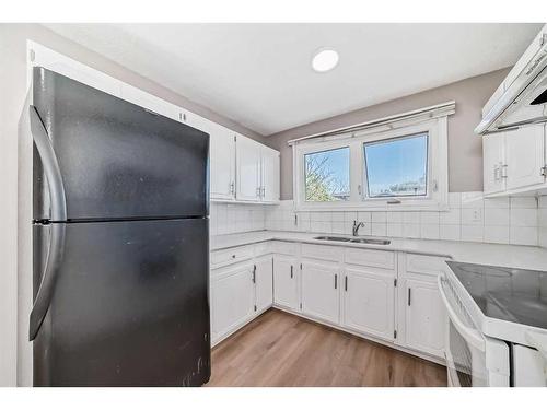 24 Whitaker Close Ne, Calgary, AB - Indoor Photo Showing Kitchen With Double Sink