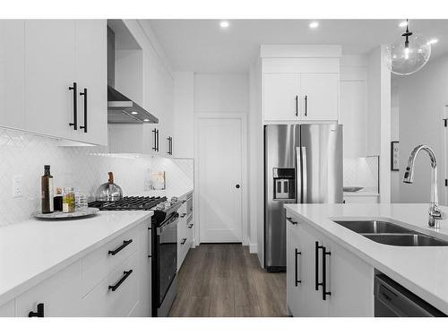 216 Crimson Ridge Place Nw, Calgary, AB - Indoor Photo Showing Kitchen With Double Sink With Upgraded Kitchen