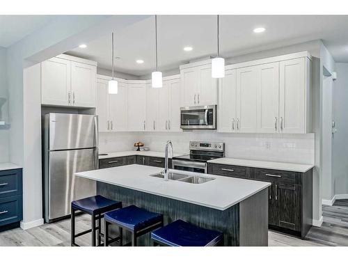 217 Lucas Crescent Nw, Calgary, AB - Indoor Photo Showing Kitchen With Stainless Steel Kitchen With Double Sink With Upgraded Kitchen