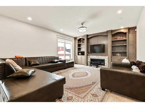 58 Lucas Cove Nw, Calgary, AB - Indoor Photo Showing Living Room With Fireplace