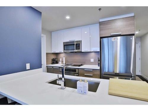 408-235 9A Street Nw, Calgary, AB - Indoor Photo Showing Kitchen With Stainless Steel Kitchen With Upgraded Kitchen