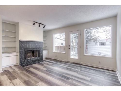 2204 2 Avenue Nw, Calgary, AB - Indoor Photo Showing Living Room With Fireplace