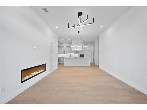 111-835 78 Street Sw, Calgary, AB - Indoor With Fireplace