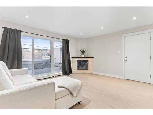 5-1611 26 Avenue Sw, Calgary, AB - Indoor Photo Showing Living Room With Fireplace