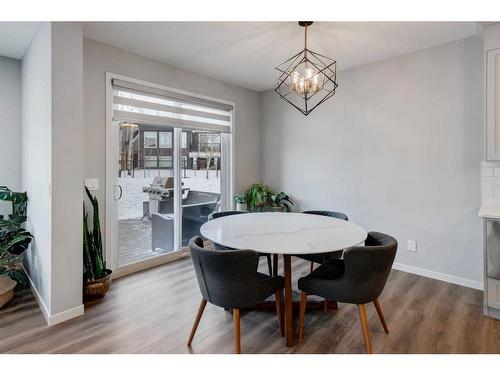 45 Legacy Woods Place Se, Calgary, AB - Indoor Photo Showing Dining Room With Fireplace