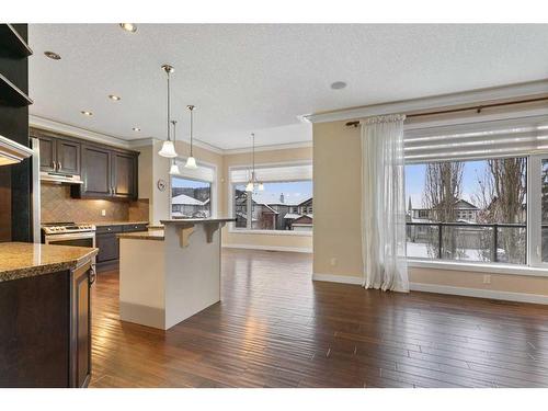 16 Sunset Close, Cochrane, AB - Indoor Photo Showing Kitchen With Upgraded Kitchen