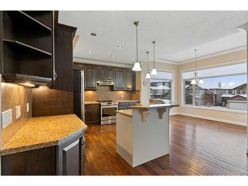 16 Sunset Close, Cochrane, AB - Indoor Photo Showing Kitchen With Upgraded Kitchen