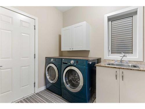 16 Sunset Close, Cochrane, AB - Indoor Photo Showing Laundry Room