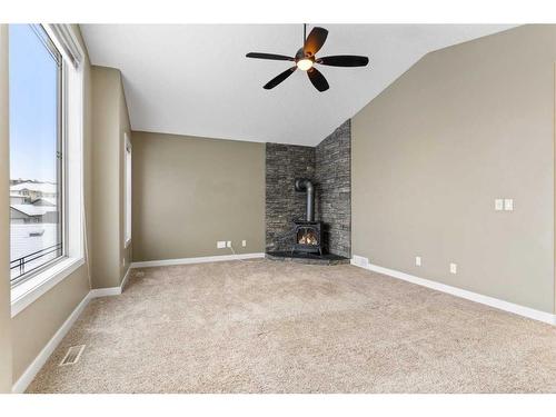 16 Sunset Close, Cochrane, AB - Indoor With Fireplace