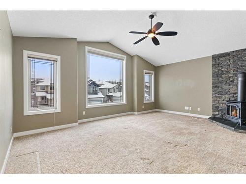 16 Sunset Close, Cochrane, AB - Indoor With Fireplace