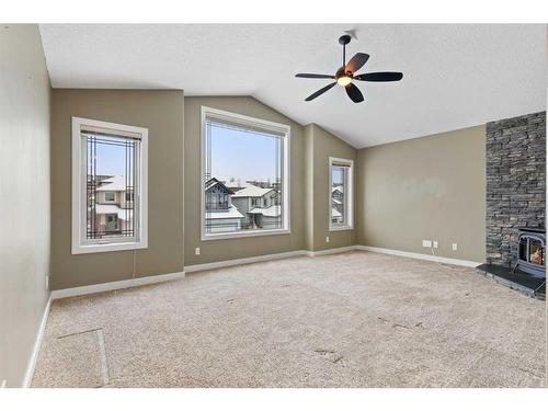 16 Sunset Close, Cochrane, AB - Indoor Photo Showing Other Room With Fireplace