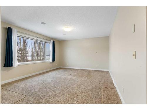 16 Sunset Close, Cochrane, AB - Indoor Photo Showing Other Room