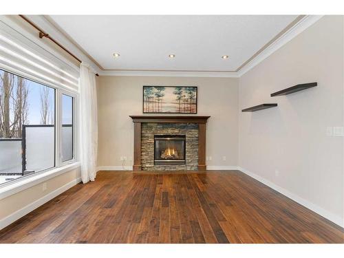 16 Sunset Close, Cochrane, AB - Indoor Photo Showing Living Room With Fireplace