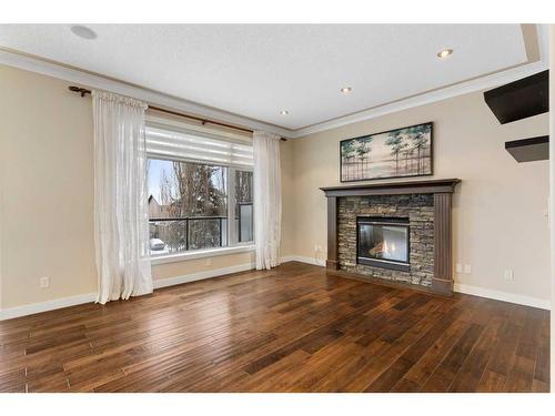 16 Sunset Close, Cochrane, AB - Indoor Photo Showing Living Room With Fireplace