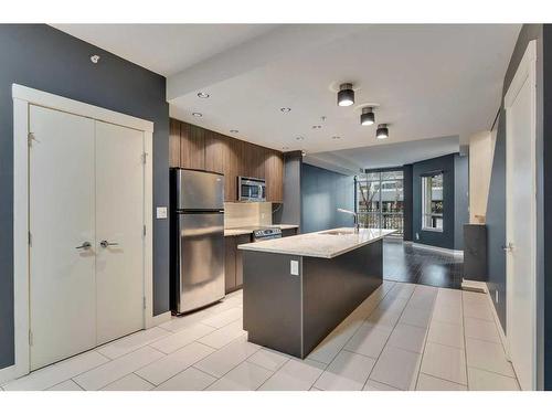 103-788 12 Avenue Sw, Calgary, AB - Indoor Photo Showing Kitchen With Stainless Steel Kitchen