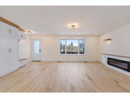 619 Arlington Drive Se, Calgary, AB - Indoor Photo Showing Living Room With Fireplace