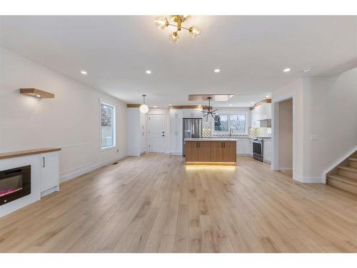 619 Arlington Drive Se, Calgary, AB - Indoor Photo Showing Living Room With Fireplace