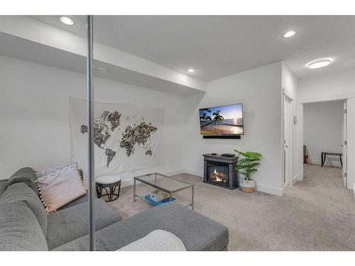 1-1922 25A Street Sw, Calgary, AB - Indoor With Fireplace