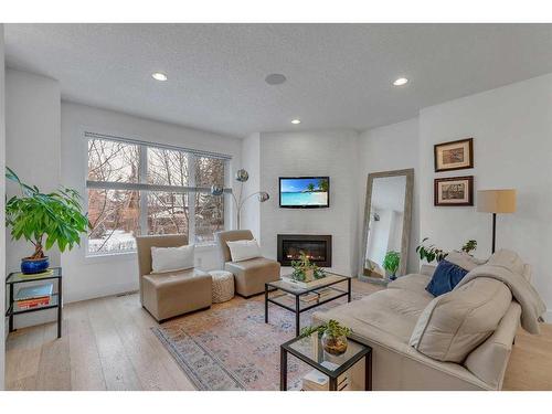 1-1922 25A Street Sw, Calgary, AB - Indoor Photo Showing Living Room With Fireplace