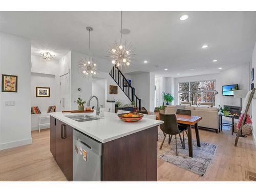 1-1922 25A Street Sw, Calgary, AB - Indoor Photo Showing Kitchen With Double Sink With Upgraded Kitchen