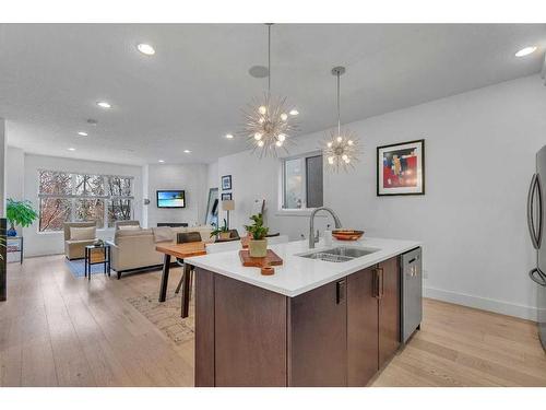 1-1922 25A Street Sw, Calgary, AB - Indoor Photo Showing Kitchen With Double Sink