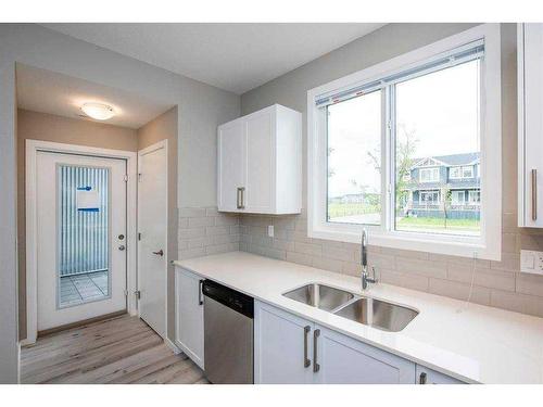 151 Redstone Drive Ne, Calgary, AB - Indoor Photo Showing Kitchen With Double Sink