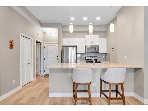 408-10 Mahogany Mews Se, Calgary, AB - Indoor Photo Showing Kitchen With Stainless Steel Kitchen With Upgraded Kitchen